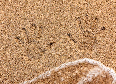 hand pints in beach image